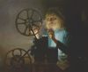 Oil portrait of Annie Lore with antique movie projector by Virgil Elliott